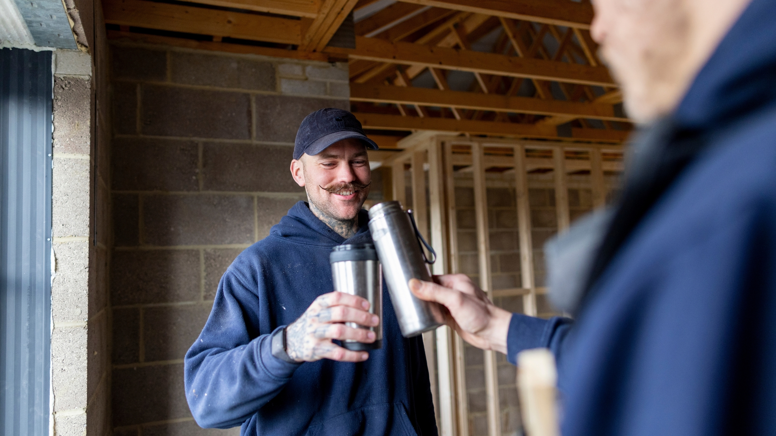 Builders taking a tea break with a flask