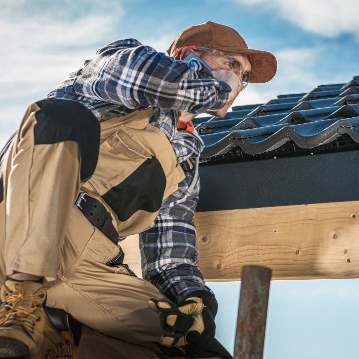 roofer speaking in phone during work